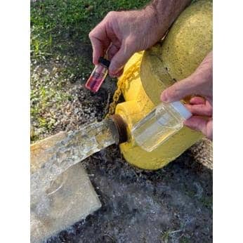 Winter Springs utility technicians tested water in the Oak Forest neighborhood the same afternoon that a fake boil water notice circulated on Facebook, determining no issues with the water. The pink vial (pictured) shows a test that determined proper residual chlorine.