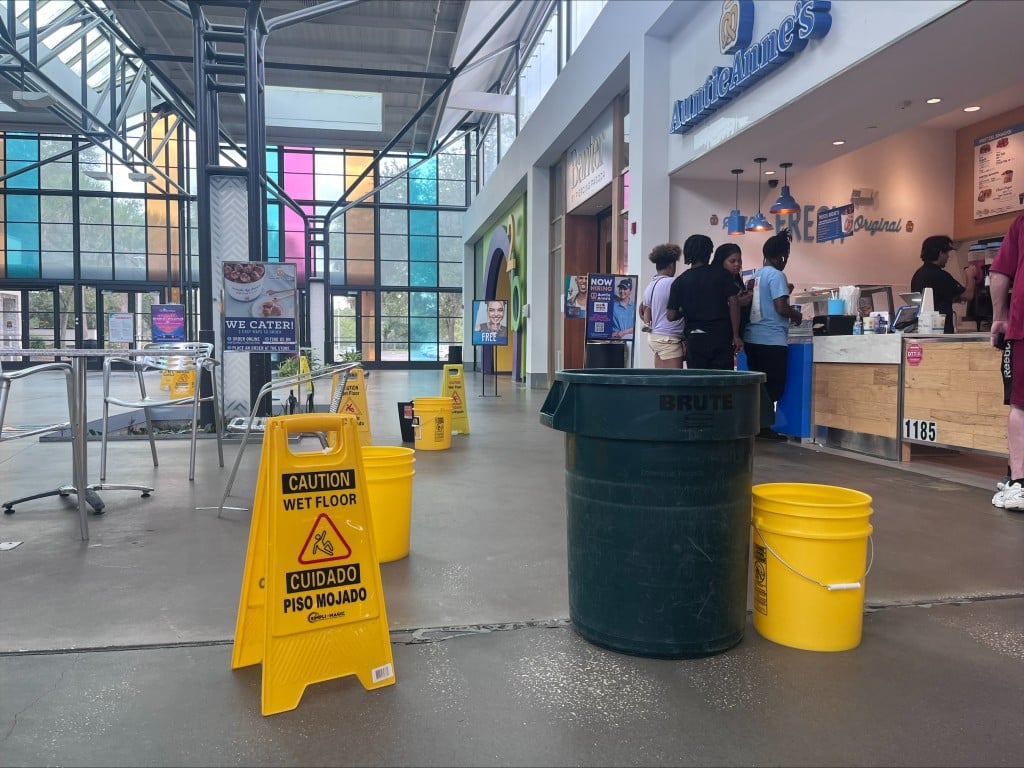 An image of buckets under roof leaks in the Oviedo Mall. 