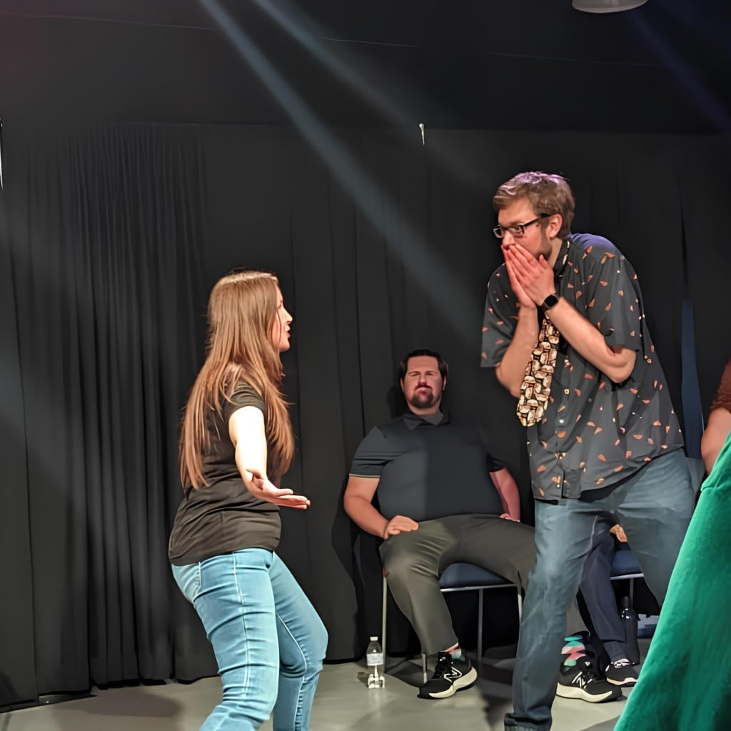 Actors in the Imaginary Friends improv troupe perform.