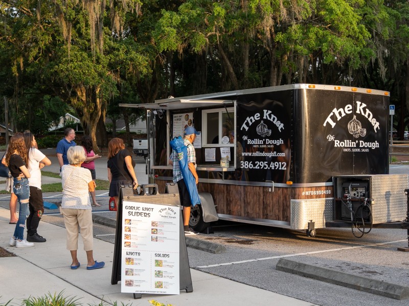 Patrons stand in line at The Knot food truck at the City of Winter Springs' Food Truck Thursday.