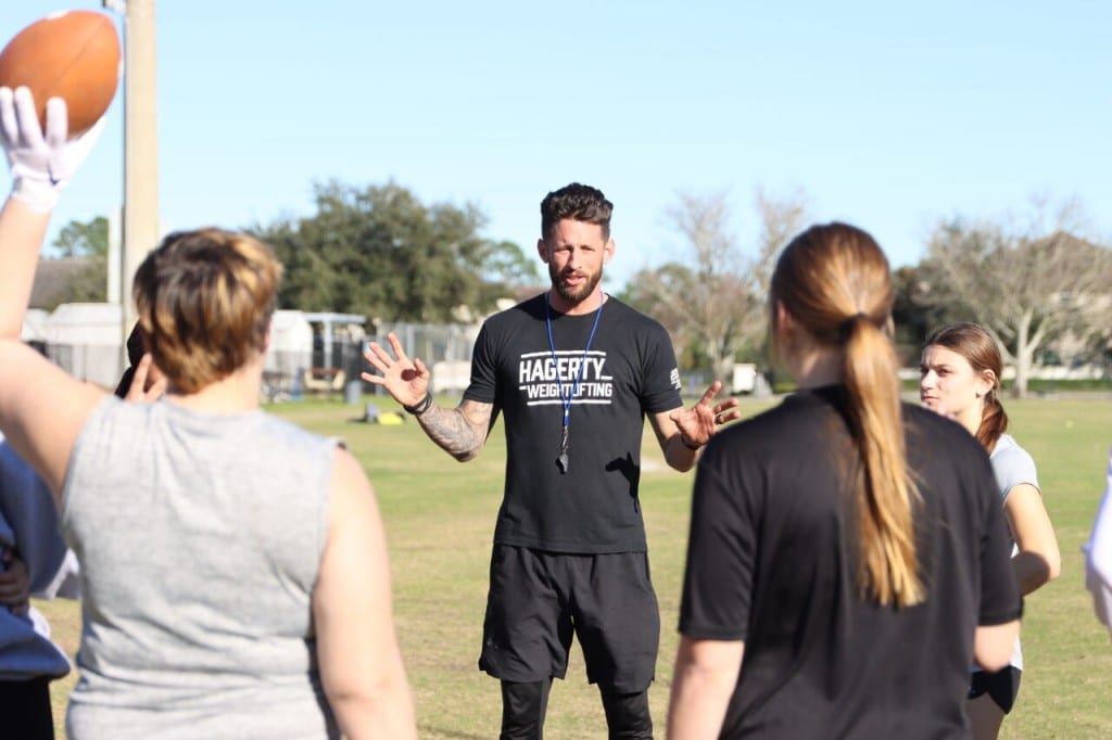 Head coach David Attaway explains the next drill to the girls at tryouts. 